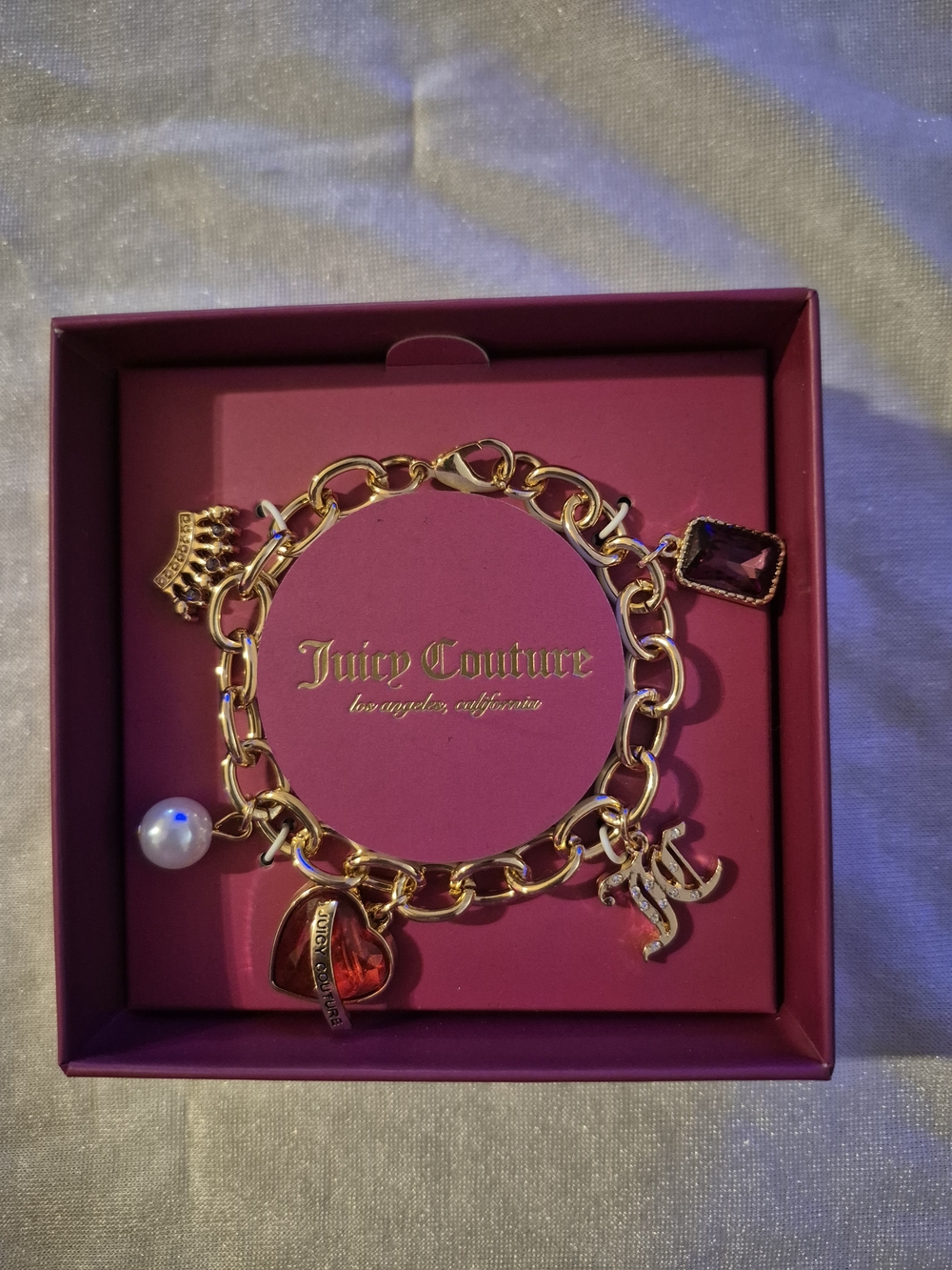 Juicy Couture Gold Charm Bracelet with Crown, Faux Pearl, Red Crytstal Heart
